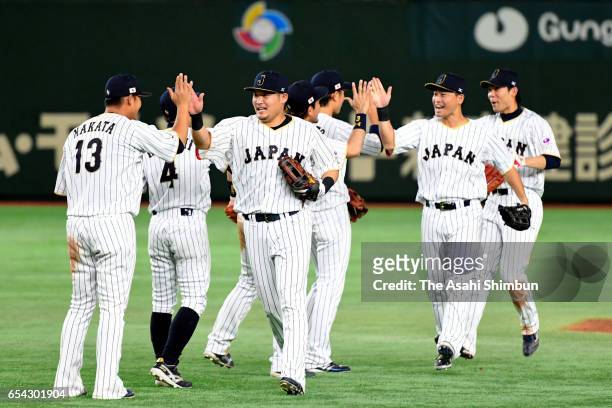 Japanese players celebrate after the World Baseball Classic Pool E Game Four between Cuba and Japan at the Tokyo Dome on March 14, 2017 in Tokyo,...