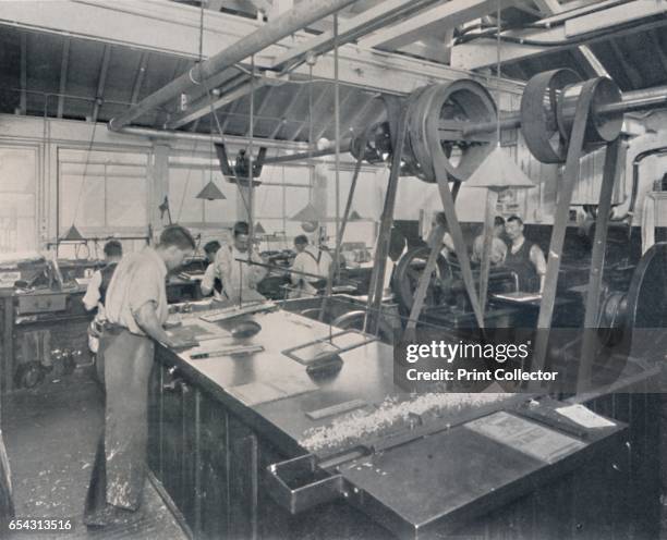 Final Operations in the Foundry. Trimming the Plates and Finishing, 1917. A photograph of the Illustrated London News and the Sketch office. From The...