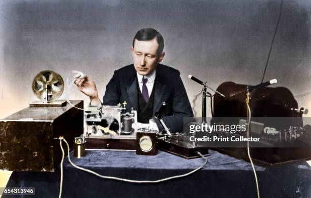 Guglielmo Marconi, Italian physicist and radio pioneer. Marconi with typical apparatus, including 10-inch induction coil spark transmitter , morse...