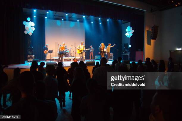 worship event for teens. - genesis entertainment group stock pictures, royalty-free photos & images