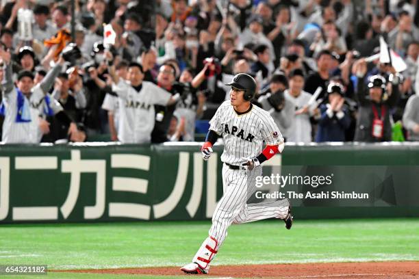 Designated hitter Tetsuto Yamada of Japan runs after hitting a two run homer in the bottom of the eighth inning during the World Baseball Classic...