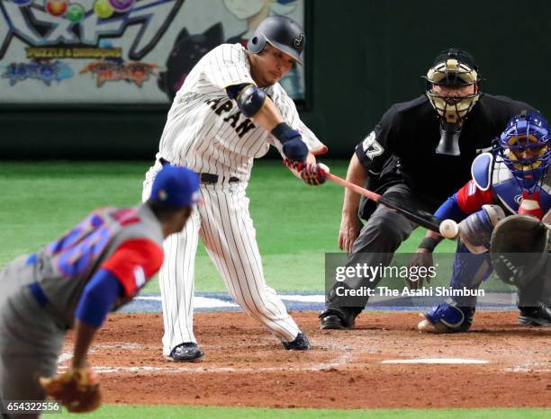 Outfielder Yoshitomo Tsutsugoh of Japan hits a RBI single to make it 4-4 in the bottom of the fifth inning during the World Baseball Classic Pool E...