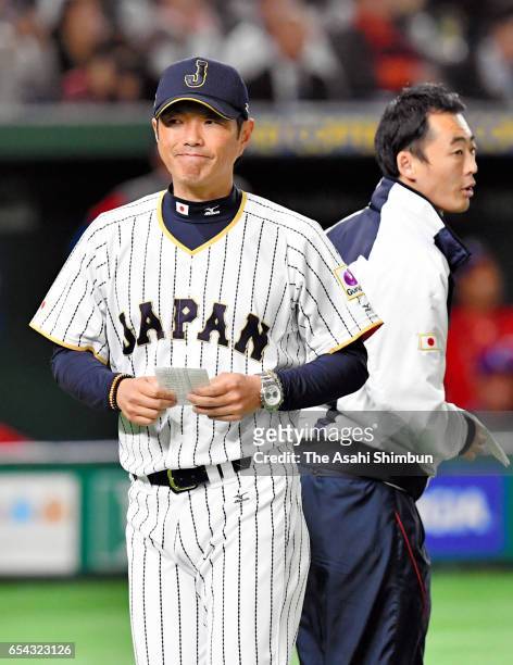 Manager Hiroki Kokubo of Japan calls a pitching change before the top of fifth inning during the World Baseball Classic Pool E Game Four between Cuba...