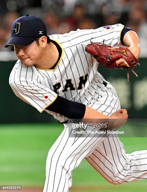 Starting Pitcher Tomoyuki Sugano of Japan throws in the top of the first inning during the World Baseball Classic Pool E Game Four between Cuba and...