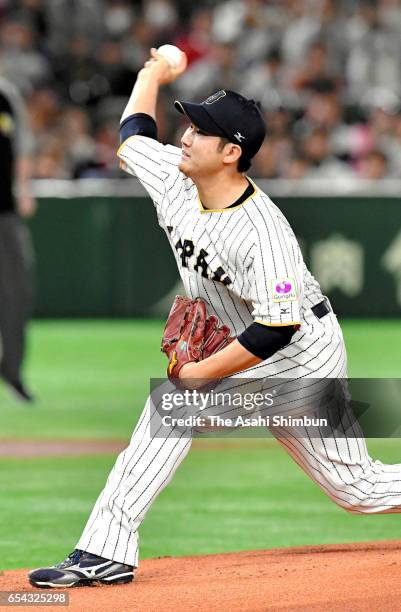 Starting Pitcher Tomoyuki Sugano of Japan throws in the top of the first inning during the World Baseball Classic Pool E Game Four between Cuba and...