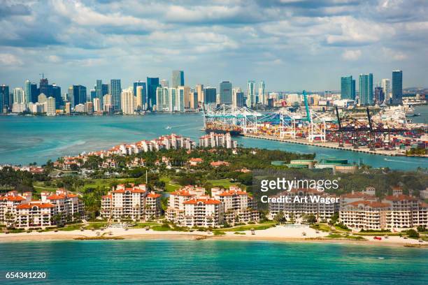 aerial view of miami florida with fisher island in foreground - port of miami dade stock pictures, royalty-free photos & images