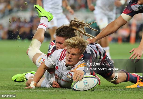 Damian McKenzie of the Chiefs scores a try which was later disallowed during the round four Super Rugby match between the Rebels and the Chiefs at...