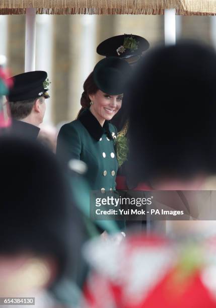 The Duke of Cambridge, Colonel of the Irish Guards, and the Duchess of Cambridge, visit the 1st Battalion Irish Guards during the St. Patrick's Day...