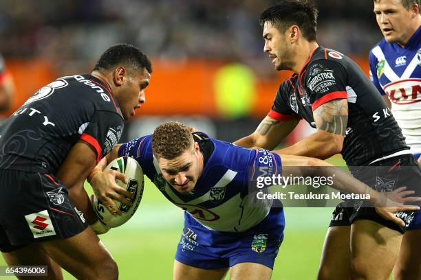 Brenko Lee of the Bulldogs is tackled during the round three NRL match between the Bulldogs and the Warriors at Forsyth Barr Stadium on March 17,...