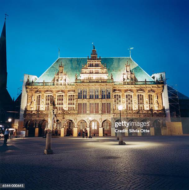 illuminated facade of building - bremen stock pictures, royalty-free photos & images