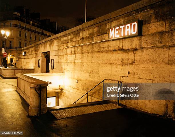 paris metro entrance at night - paris metro stock pictures, royalty-free photos & images