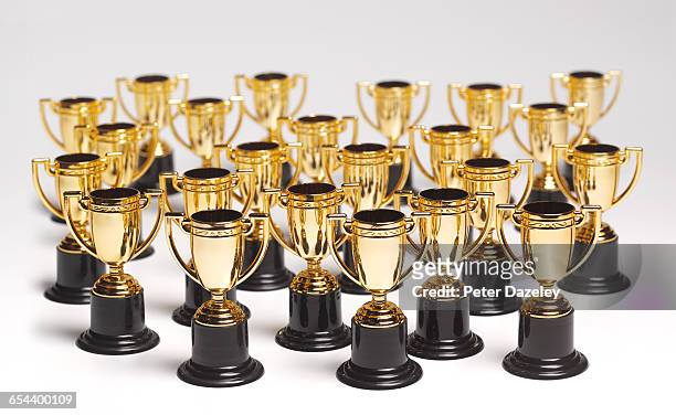 an abundance of trophies - trophy award stock pictures, royalty-free photos & images