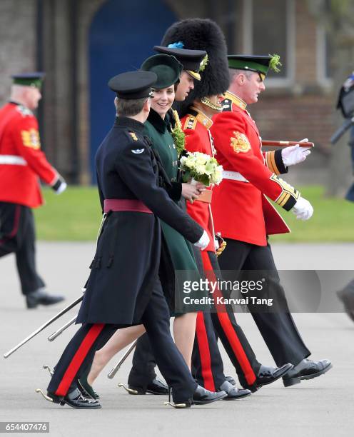 Catherine, Duchess of Cambridge presents the 1st Battalion Irish Guardsmen with shamrocks during the annual Irish Guards St Patrick's Day Parade at...