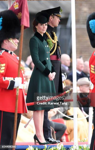 Catherine, Duchess of Cambridge and Prince William, Duke Of Cambridge presents the 1st Battalion Irish Guardsmen with shamrocks during the annual...