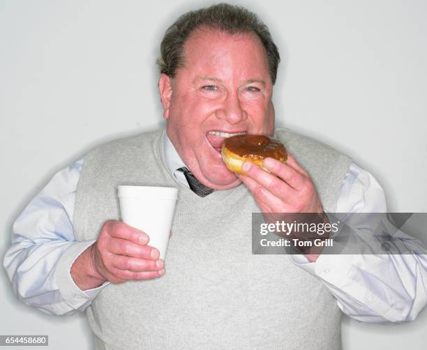 man with coffee and doughnut - fat guy eating donuts stock pictures, royalty-free photos & images