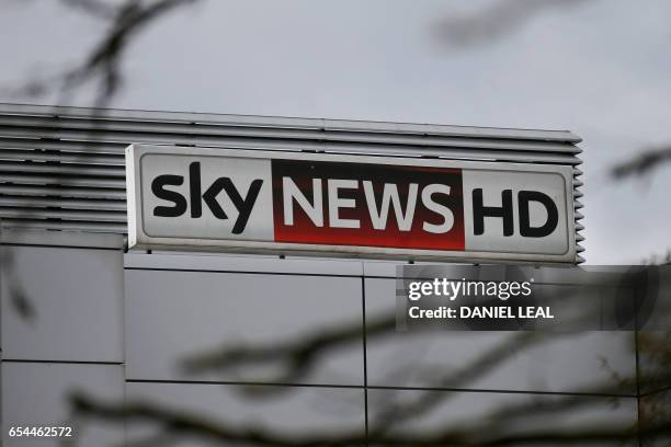 Sky News HD logo is pictured on a sign outside pay-TV giant Sky Plc's headquarters in Isleworth, west London on March 17, 2017. A proposed...