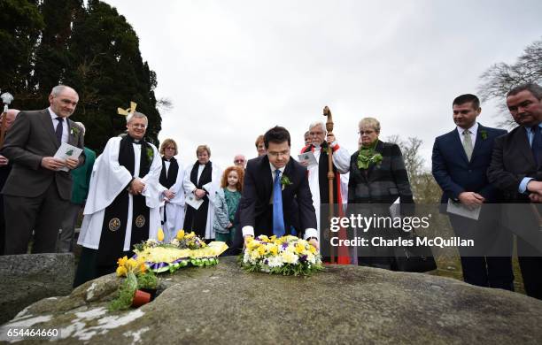 Northern Ireland Secretary of State James Brokenshire takes part in the wreath laying ceremony at Saint Patrick's grave outside Down Cathedral on...