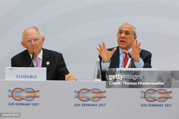 Secretary-General Angel Gurria and Federal Minister of Finance Wolfgang Schaeuble are seen during the 'Going for Growth' report presentation during...