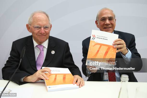 Secretary-General Angel Gurria and Federal Minister of Finance Wolfgang Schaeuble present the 'Going for Growth' report during the G20 finance...