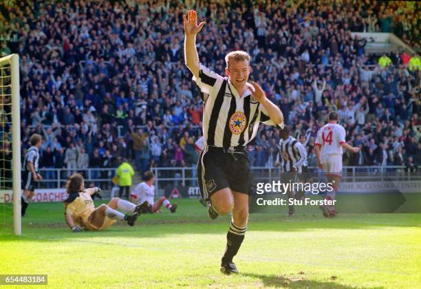 Newcastle striker Alan Shearer celebrates after scoring in the 77th minute as Sunderland goalkeeper Lionel Perez is left stranded during the FA...