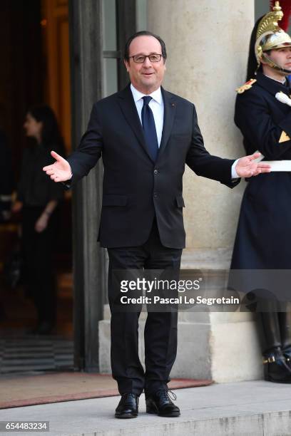 French President Francois Hollande poses after a meeting with Prince William, Duke of Cambridge and Catherine, Duchess of Cambridge at the Elysee...