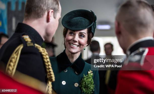 Prince William, Duke Of Cambridge and Catherine, Duchess of Cambridge talk with soldiers of the 1st Battalion Irish Guards following their St...