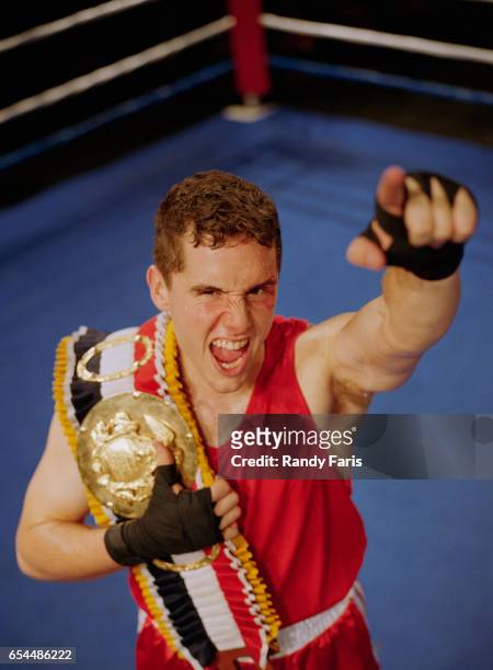boxer celebrating win - championship belt stock-fotos und bilder