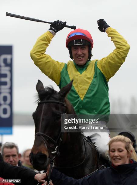 Jockey Robbie Power celebrates after winning the Gold Cup during Gold Cup Day of the Cheltenham Festival at Cheltenham Racecourse on March 17, 2017...