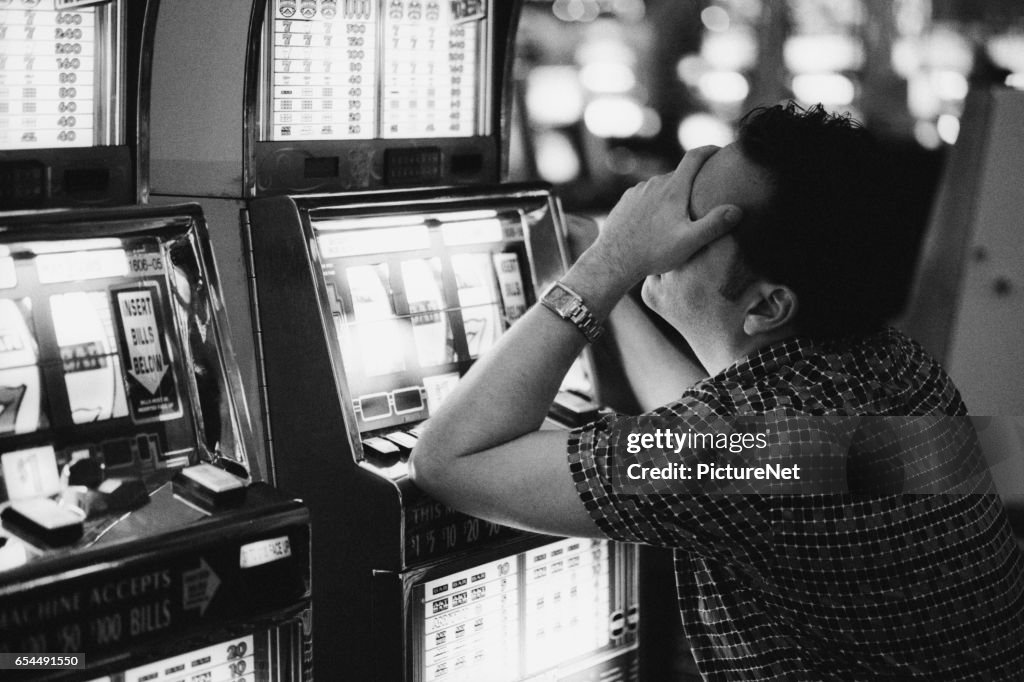 Frustrated Man at Slot Machine