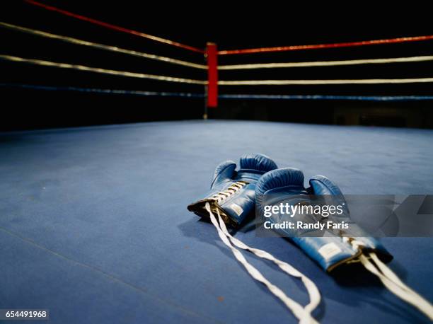 boxing gloves in ring - boxing ring empty stock pictures, royalty-free photos & images