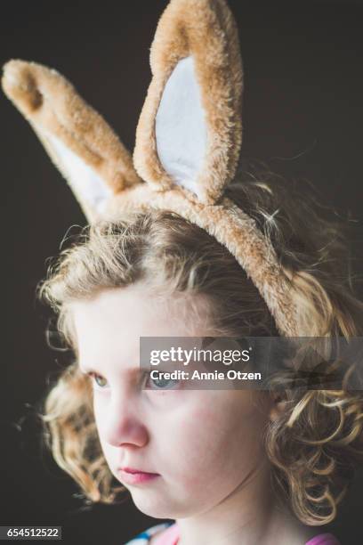 serious girl with bunny ears - easter fantasy stockfoto's en -beelden