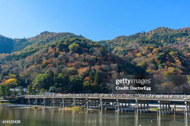 togetsukyo bridge in autumn - 渡月橋 ストックフォトと画像