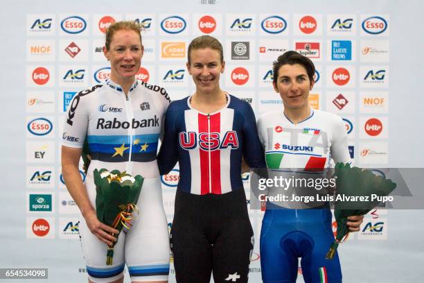 Kirsten Wild of Netherlands, Sarah Hammer of the United States and Giorgia Bronzini of Italy pose for pictures during the award ceremony of the...