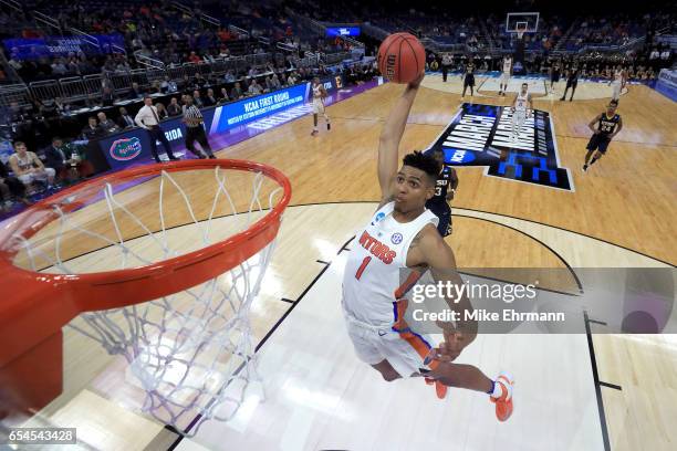 Devin Robinson of the Florida Gators dunks the ball against the East Tennessee State Buccaneers during the first round of the 2017 NCAA Men's...