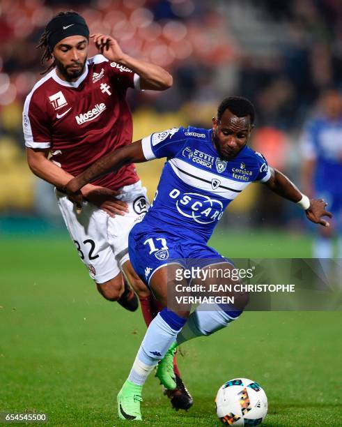 Metz' French defender Benoit Assou-Ekotto vies with Bastia's French midfielder Lenny Nangis during the French L1 football match between Metz and...