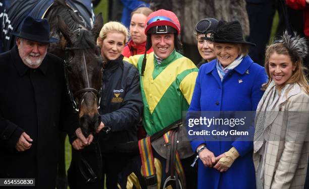 Cheltenham , United Kingdom - 17 March 2017; The winning connections of Sizing John with jockey Robbie Power including trainer Jessica Harrington,...