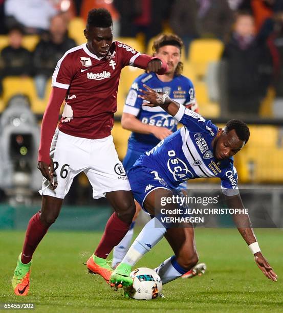 Metz' Senegalese midfielder Ismaila Sarr vies with Bastia's French midfielder Lenny Nangis during the French L1 football match between Metz and...