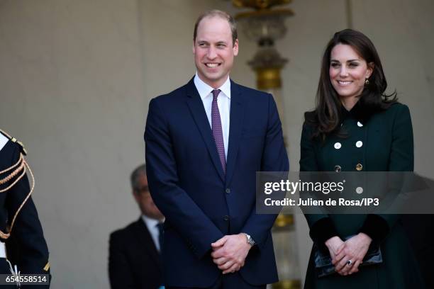 Catherine, Duchess of Cambridge and her husband Prince William, Duke of Cambridge pose after their meeting with French President Francois Hollande at...