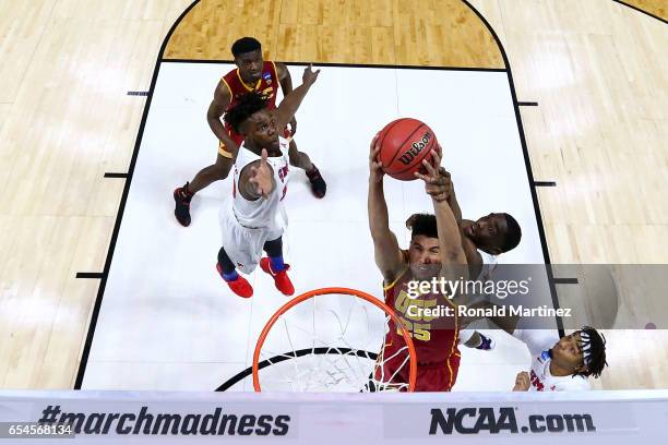 Bennie Boatwright of the USC Trojans goes up with the ball against Shake Milton of the Southern Methodist Mustangs in the first half during the first...