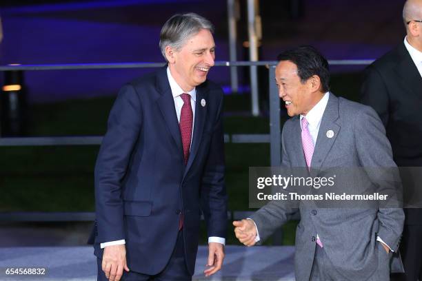 Finance Minister of the United Kingdom Philip Hammond and Japanese Finance Minister Taro Aso attend the family photo during the G20 finance ministers...