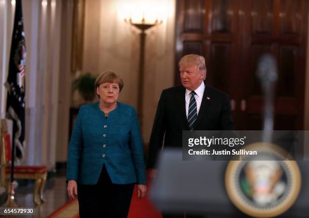 President Donald Trump arrives at a joint press conference with German Chancellor Angela Merkel in the East Room of the White House on March 17, 2017...
