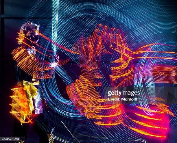 abstract drawing led glow katana - long exposure dance stock pictures, royalty-free photos & images