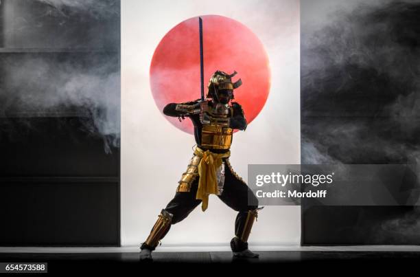 samurai on symbol of japan background - samurai stock pictures, royalty-free photos & images