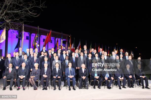 Participants pose for a family photo during the first day of the G20 Finance Ministers and Central Bank Governors Meeting in Baden-Baden, southern...
