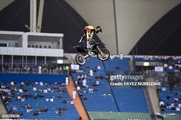 Motorcyclist performs a trick during the Monster Jam show at the King Fahad stadium in the Saudi capital Riyadh on March 17, 2017.Monster Jam, the...