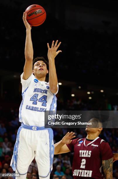 Justin Jackson of the North Carolina Tar Heels shoots against Zach Lofton of the Texas Southern Tigers in the first half during the first round of...