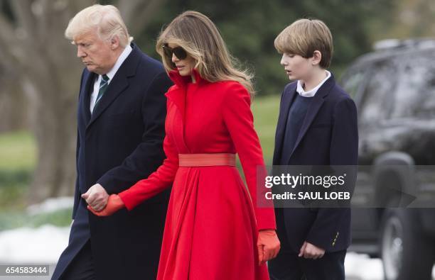 President Donald Trump, First Lady Melania Trump and their son, Barron, walk to Marine One prior to departing from the South Lawn of the White House...