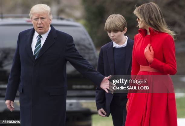 President Donald Trump, First Lady Melania Trump and their son, Barron, walk to Marine One prior to departing from the South Lawn of the White House...