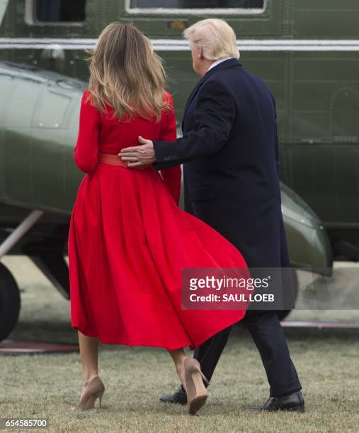 President Donald Trump and First Lady Melania Trump walk to Marine One prior to departing from the South Lawn of the White House in Washington, DC,...