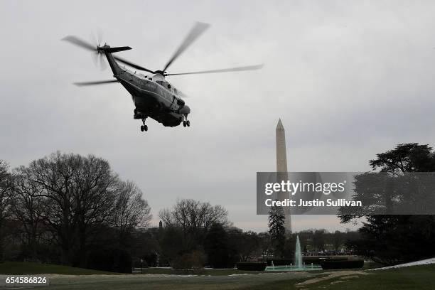 Marine One carrying U.S. President Donald Trump, First Lady Melania Trump and son Barron Trump departs from the White House on March 17, 2017 in...